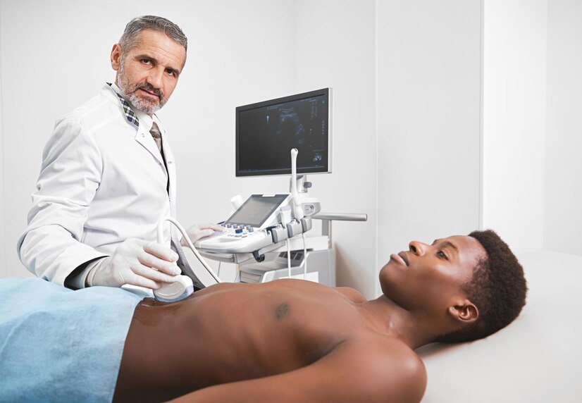 doctor-looking-camera-while-doing-ultrasound-diagnosis_651396-1277